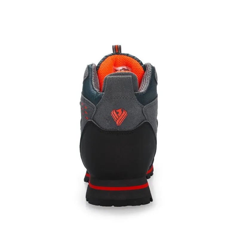 Back view of a gray and black glove with red accents on a white background