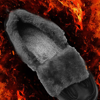 Gray fluffy glove against a fiery background
