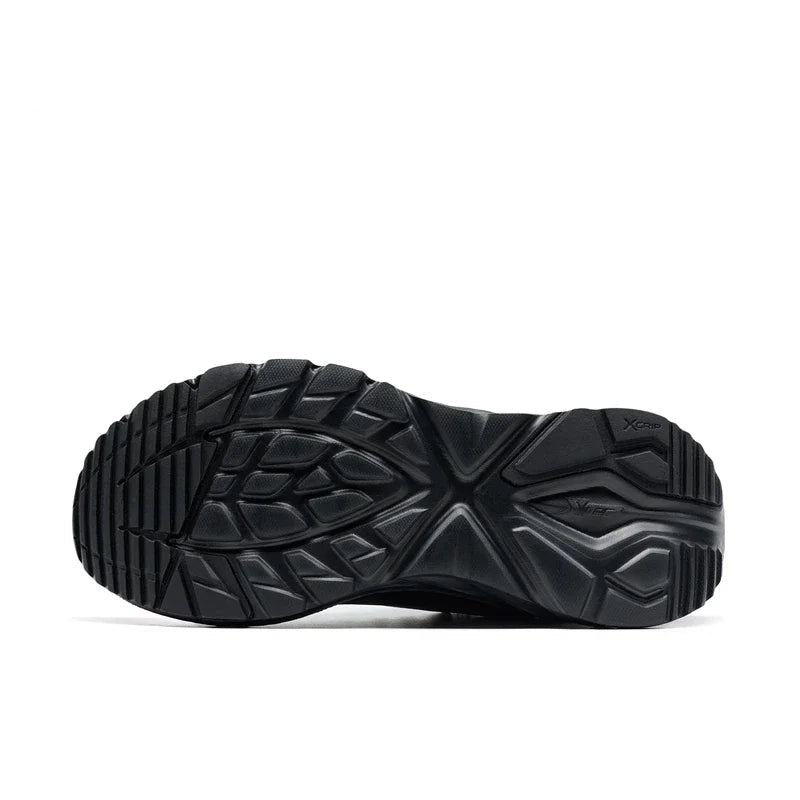 Black athletic shoe sole with XTEP branding on a white background