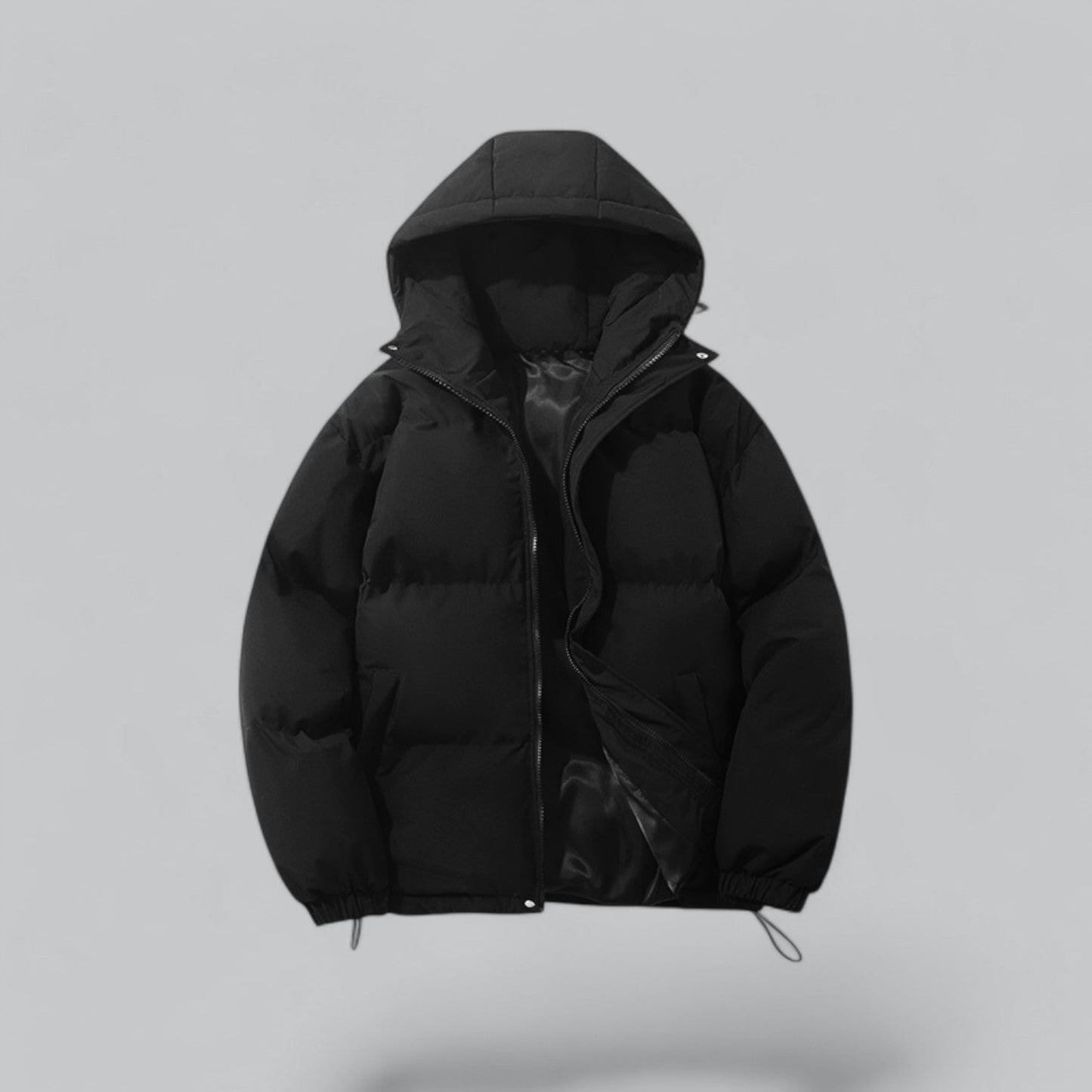 Black puffer jacket with a hood on a light gray background