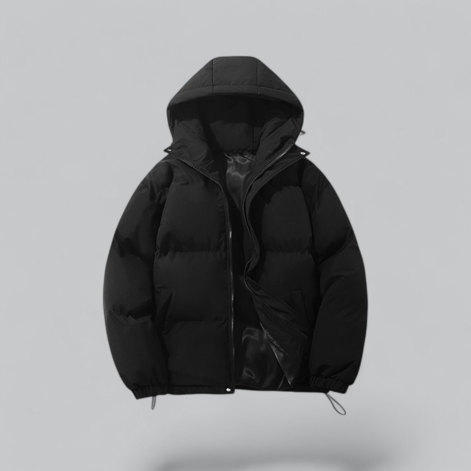 Black puffer jacket with a hood on a light gray background