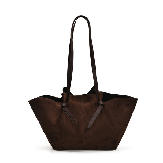 Brown tote bag with black handles on a white background