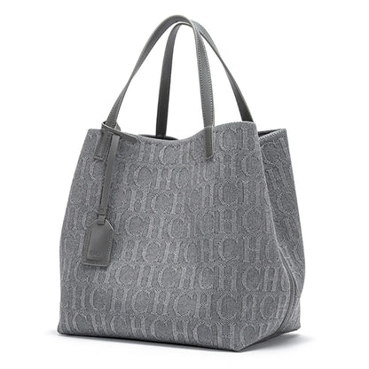 Gray tote bag with a monogram pattern on a white background