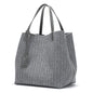 Gray tote bag with a monogram pattern on a white background