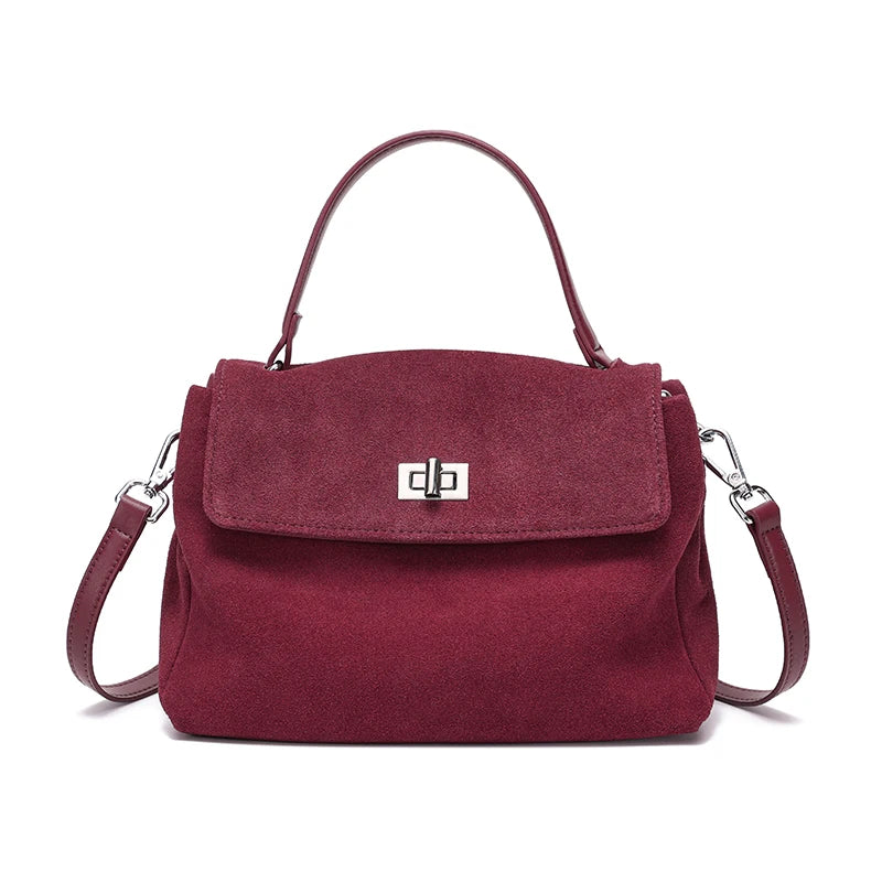 Maroon handbag with a silver clasp on a white background