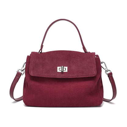Maroon handbag with a silver clasp on a white background