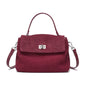 Maroon handbag with a silver clasp on a white background