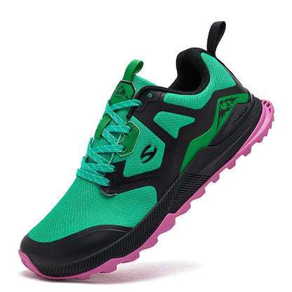 Green and black athletic shoe with pink sole on a white background