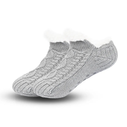 Pair of gray knitted socks on a white background