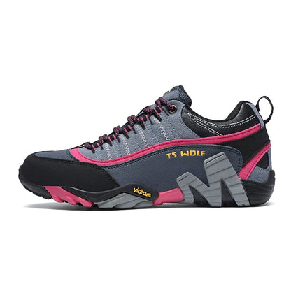 Gray and pink athletic shoe with visible branding on a white background