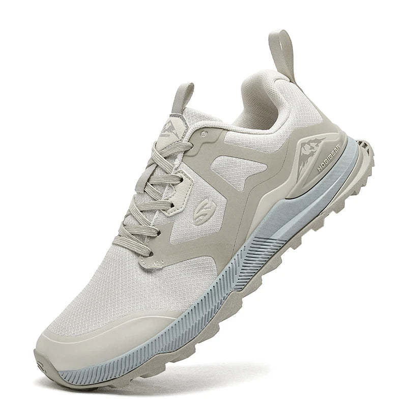 Light gray athletic shoe with white laces on a white background