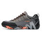 Gray and black athletic shoe with orange accents on a white background
