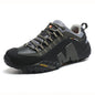 Black and gray hiking shoe with visible brand logo on a white background
