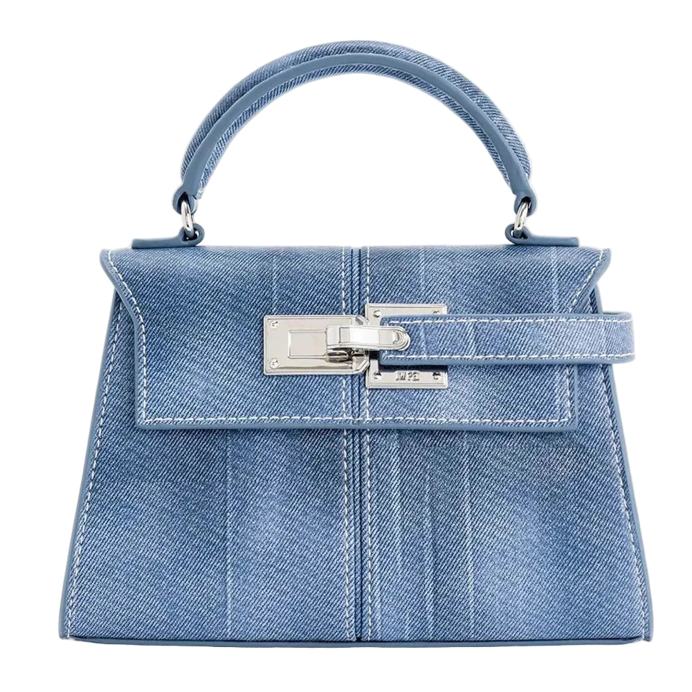 Blue denim handbag with silver hardware on a white background