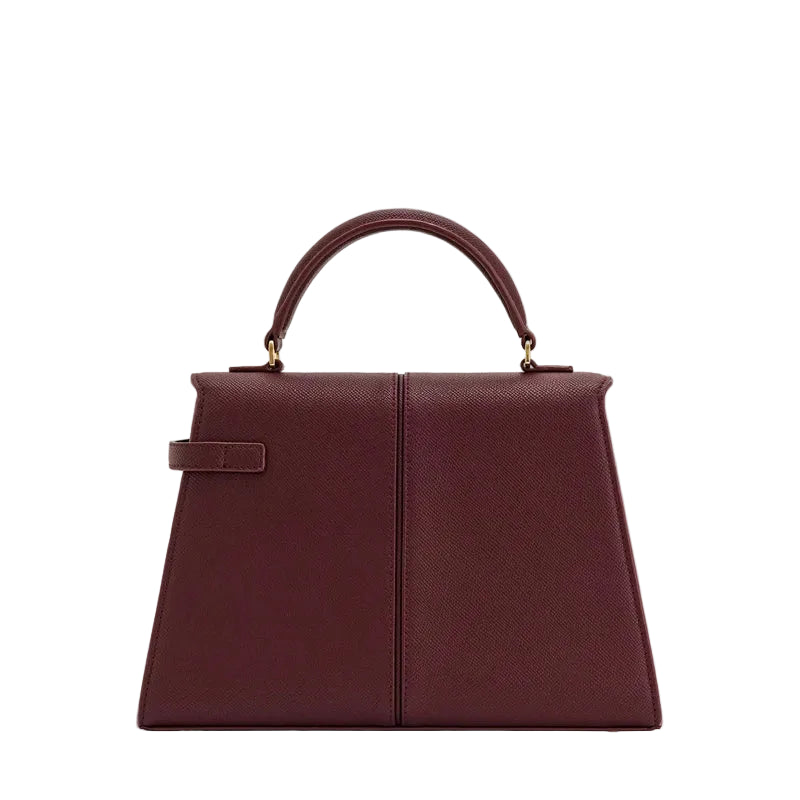 Brown handbag with a handle on a white background