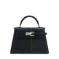 Black handbag with silver clasp on a white background