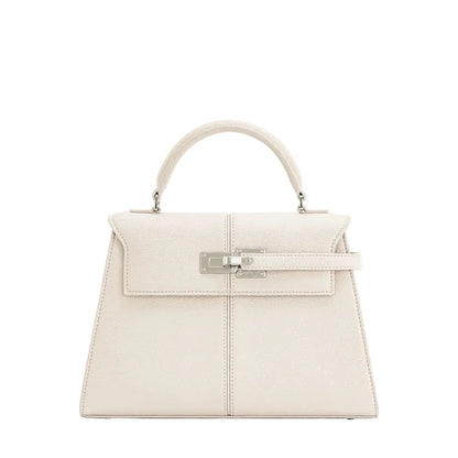 White handbag with a silver clasp on a white background