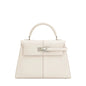 White handbag with a silver clasp on a white background
