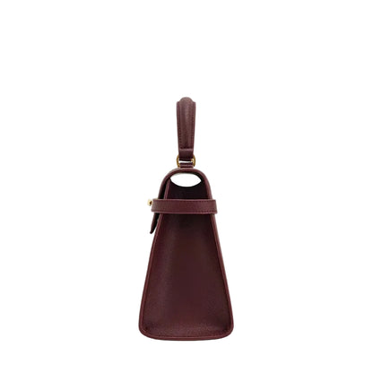 Brown leather handbag with a strap on a white background