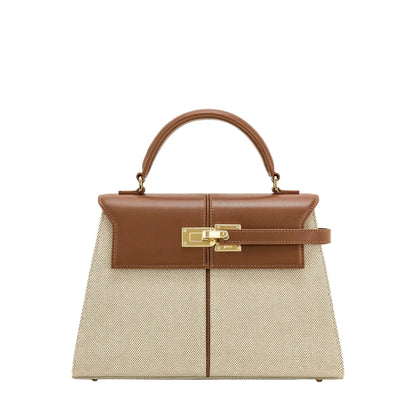 Handbag with brown top section and beige bottom section on a white background